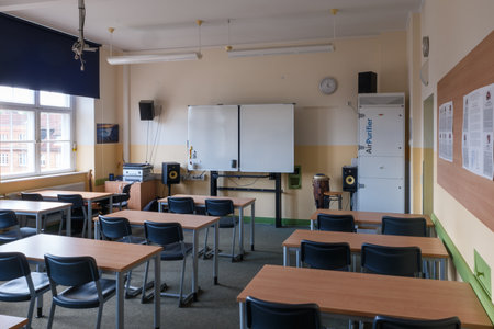 A classroom full of tables and chairsの写真素材
