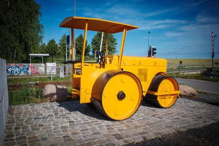 An old yellow historic leveling rollerの写真素材