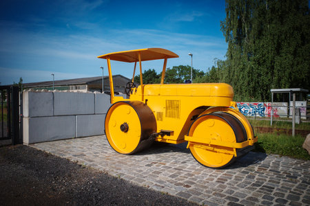 An old yellow historic leveling rollerの写真素材