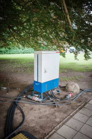 many power cables lead to a power boxの写真素材