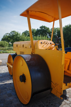 An old yellow historic leveling rollerの写真素材
