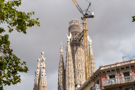 Close-up view of the Sagrada FamÃ­lia basilica in Barcelona, Spain, designed by architect Antoni GaudÃ­. The iconic UNESCO World Heritage Site features detailed Gothic and Art Nouveau architecture with towering spires and intricate stone carvings. Under construction for more than a century, this masterpiece is one of the most famous landmarks and tourist attractions in Spain.の写真素材
