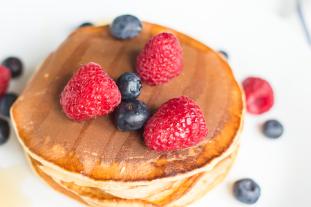 Breakfast. Berries. Pancakes. Romantic breakfast on a wooden table. Spring morning. Cozy.の写真素材