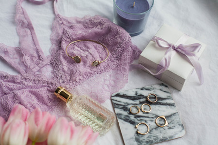 Beautiful lace lingerie. Cosmetics, decorations, a bouquet of tulips. Gift. A box with a gift. International Women's Day. Holidays. Spring. Cozyの写真素材