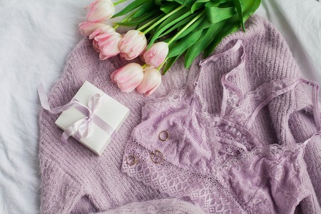 Beautiful lace lingerie. Cosmetics, decorations, a bouquet of tulips. Gift. A box with a gift. International Women's Day. Holidays. Spring. Cozyの写真素材