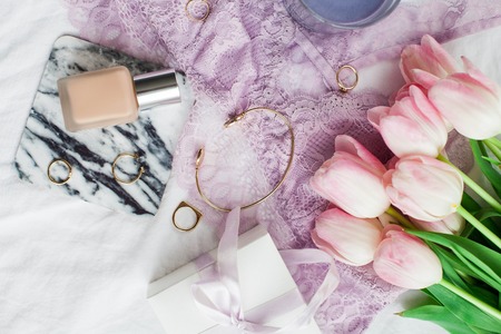 Beautiful lace lingerie. Cosmetics, decorations, a bouquet of tulips. Gift. A box with a gift. International Women's Day. Holidays. Spring. Cozyの写真素材