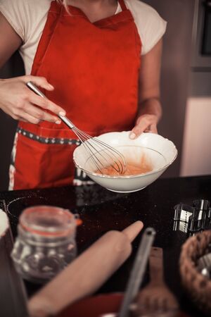 Beautiful family bake christmas cookies. Family cooks in the kitchen. Holidays. Christmas. New Year.の写真素材