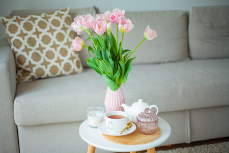 Bouquet of beautiful tulips in a vase in a home interior.の写真素材