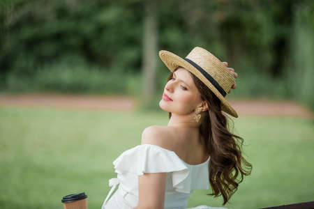 Portrait of a beautiful young pregnant woman in nature. Happiness. Summer.の写真素材