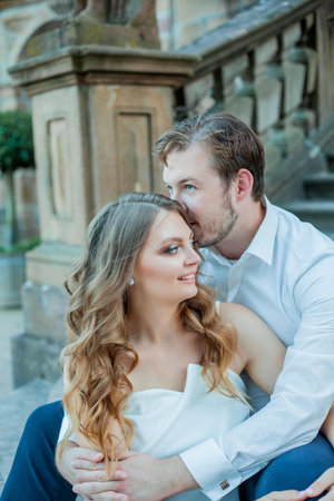 Beautiful young couple in love near the old palace. Wedding.の写真素材