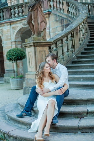 Beautiful young couple in love near the old palace. Wedding.の写真素材