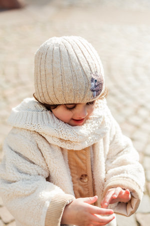 Little cute daughter of 4 years old walks in the center of the old city. Europe.の写真素材