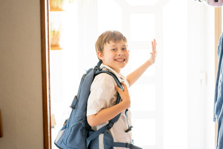Back to school. Cute happy boy with backpack going to school from home. Cozy.