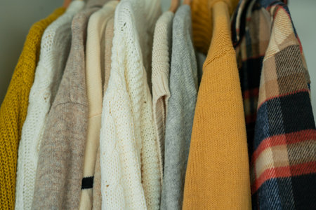 Warm autumn clothes knitted in the closet. Organization.の写真素材