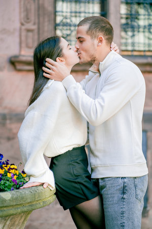 Young beautiful couple in love, happy walking in European small town with beautiful views. Germany in spring.の写真素材