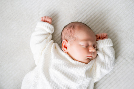 Little newborn boy in knitted clothes sleeping. baby.