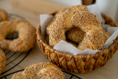 Hot homemade Turkish simit in the kitchen. Bagels with sesame seeds.