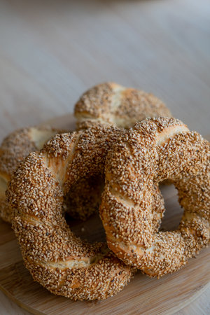 Hot homemade Turkish simit in the kitchen. Bagels with sesame seeds.