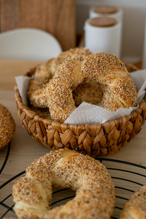 Hot homemade Turkish simit in the kitchen. Bagels with sesame seeds.