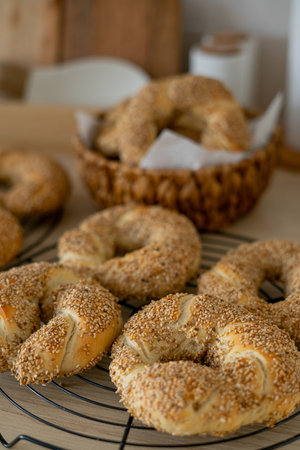 Hot homemade Turkish simit in the kitchen. Bagels with sesame seeds.