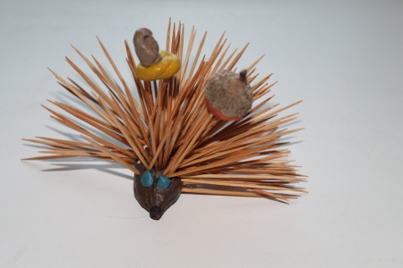 A handmade playdough hedgehog with acornsの写真素材