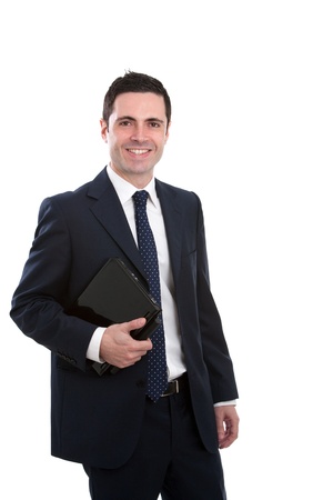 Handsome young business man in blue suit holding laptop. Isolated on white.の写真素材
