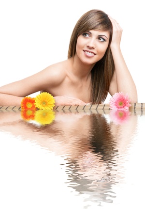 Close up beauty Portrait of young woman with water reflection and flowers.の写真素材