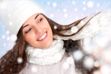 Close up of attractive winter girl with snowflakes.の写真素材