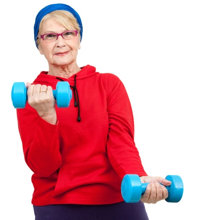 Portrait of healthy elderly woman with weights Isolated on white の写真素材