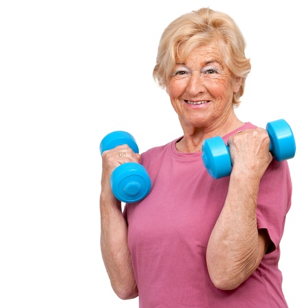 Portrait of healthy senior woman doing workout with weights Isolated on white の写真素材