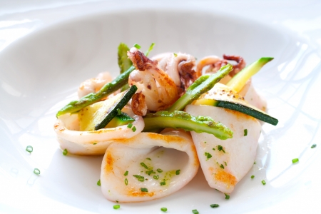 Macro Close up of grilled calamari and green asparagus.の写真素材