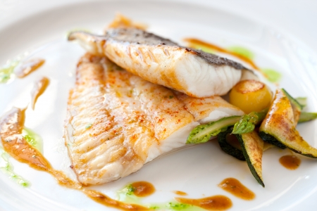 Close up of Grilled turbot fish with vegetables.の写真素材
