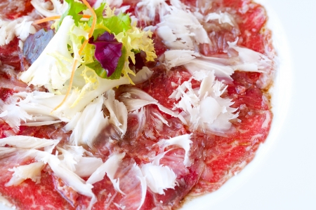 Close up macro of beef carpaccio with parmesan cheese flocks.の写真素材