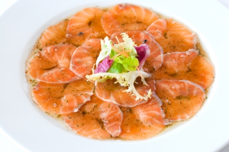 Close up of smoked salmon carpaccio dish.の写真素材