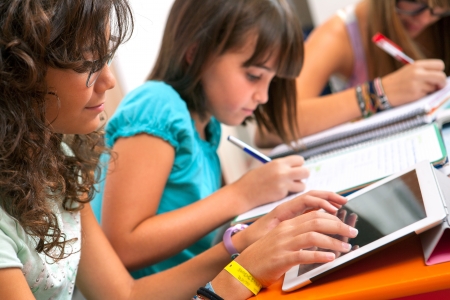 Close up of Teenage girls doing homework.