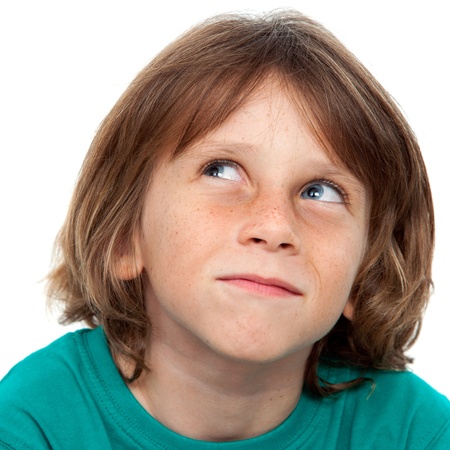 Close up portrait of boy with wondering face expression.Isolated on white.の写真素材
