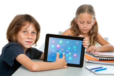 Close up portrait of cute maths student pointing at numbers on ditital tablet の写真素材