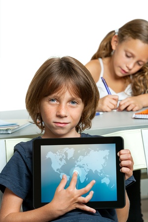 Close up of young boy student showing world map on digital tablet screen Isolated on white の写真素材