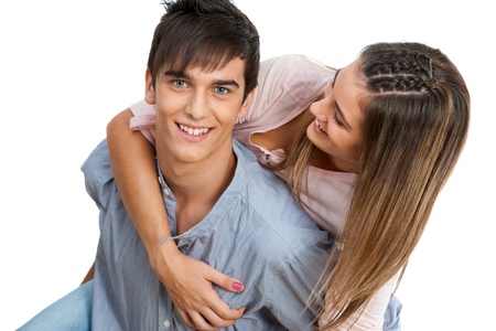 Close up of handsome teen couple piggybacking.Isolated on white.の写真素材