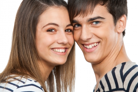Macro close up portrait of handsome teen couple. Isolated on white.の写真素材