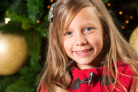 Close up portrait of cute girl wishing merry christmas の写真素材