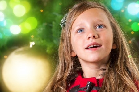 Close up portrait of cute girl showing christmas illusion の写真素材