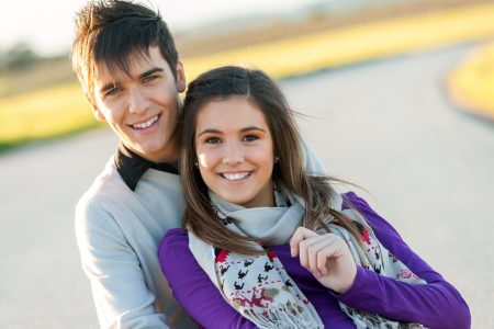 Close up portrait of handsome young couple in countryside.の写真素材