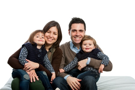 Close up portrait of young family on couch.isolated.の写真素材