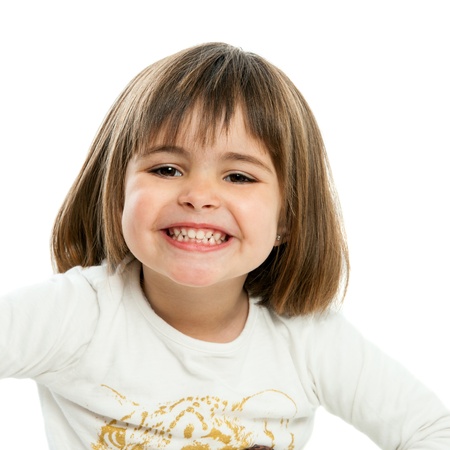 Close up portrait of cute girl showing teeth. Isolated on white.の写真素材