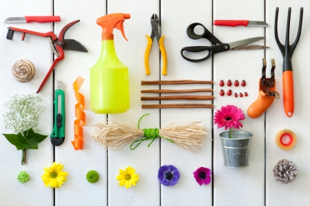 Close up of gardening and florist tools on white wooden background.の写真素材