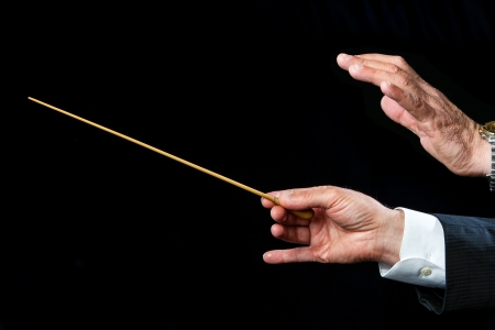 Close up of male conductors hands ready to direct.の写真素材