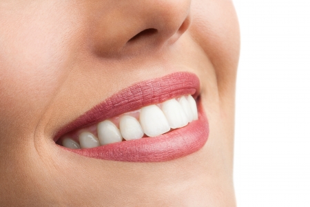 Macro close up of perfect female teeth isolated on white.の写真素材