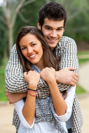 Close up portrait of young couple together in park.の写真素材