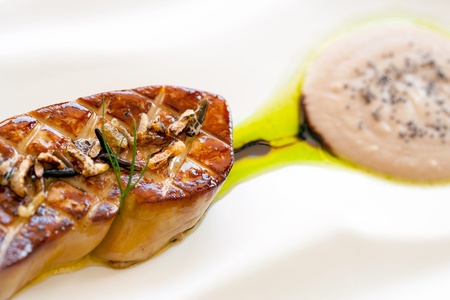 Macro close up of grilled foie gras with honey and apple pure の写真素材